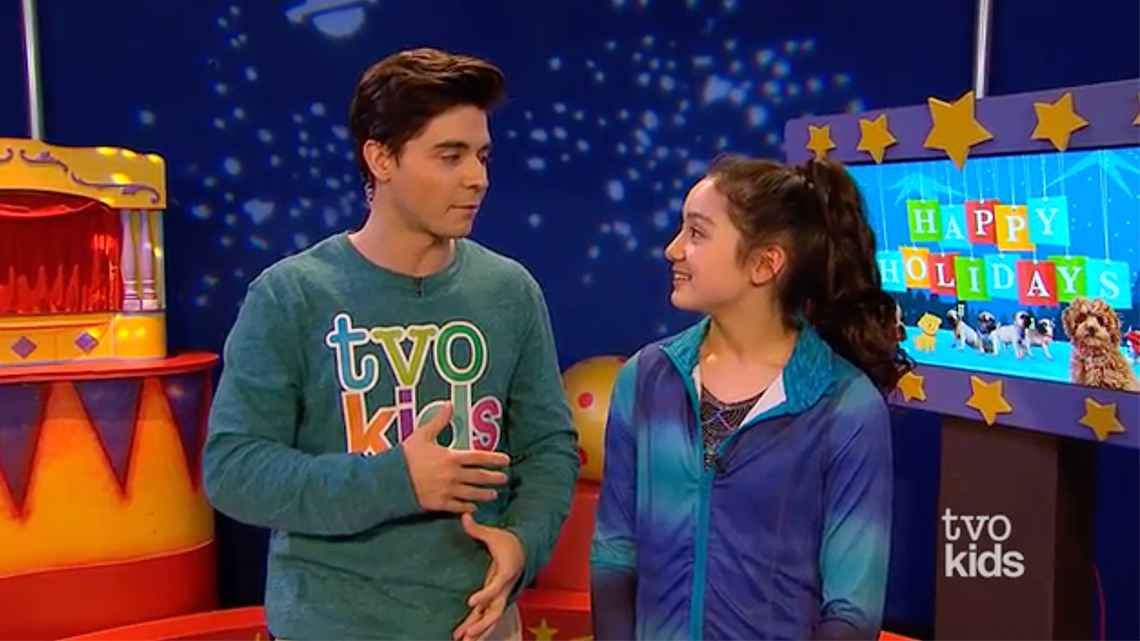 Celeste and Lucas are turned towards each other.