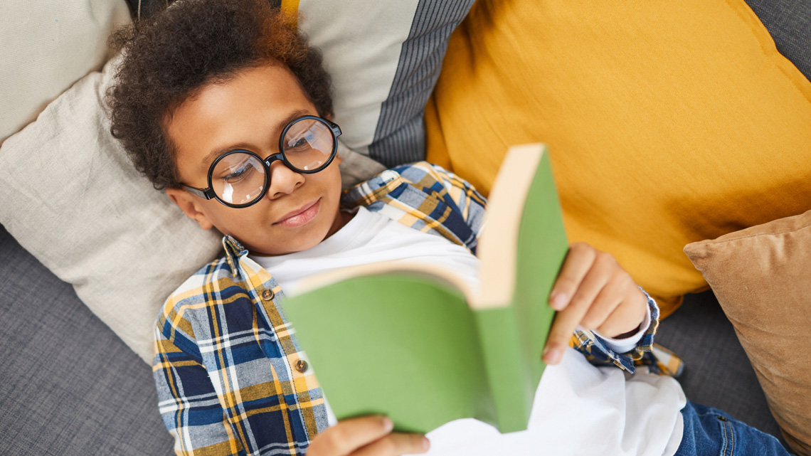 Kid reading a book