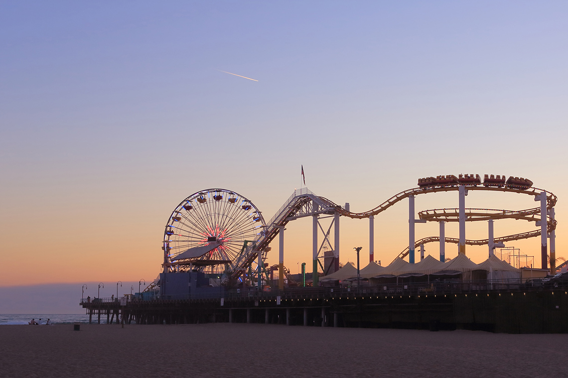 A small amusement park on a beach.