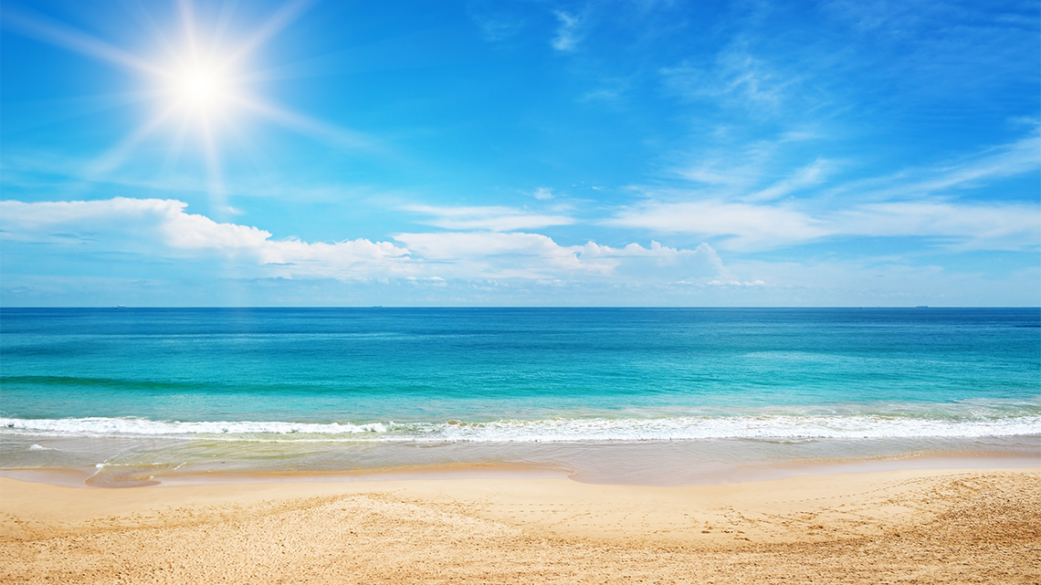 A sandy beach and water