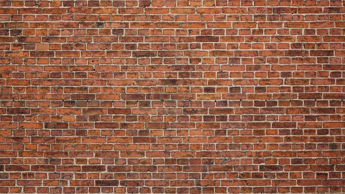 Bricks laid on top of each other lengthwise and widthwise in alternating rows.