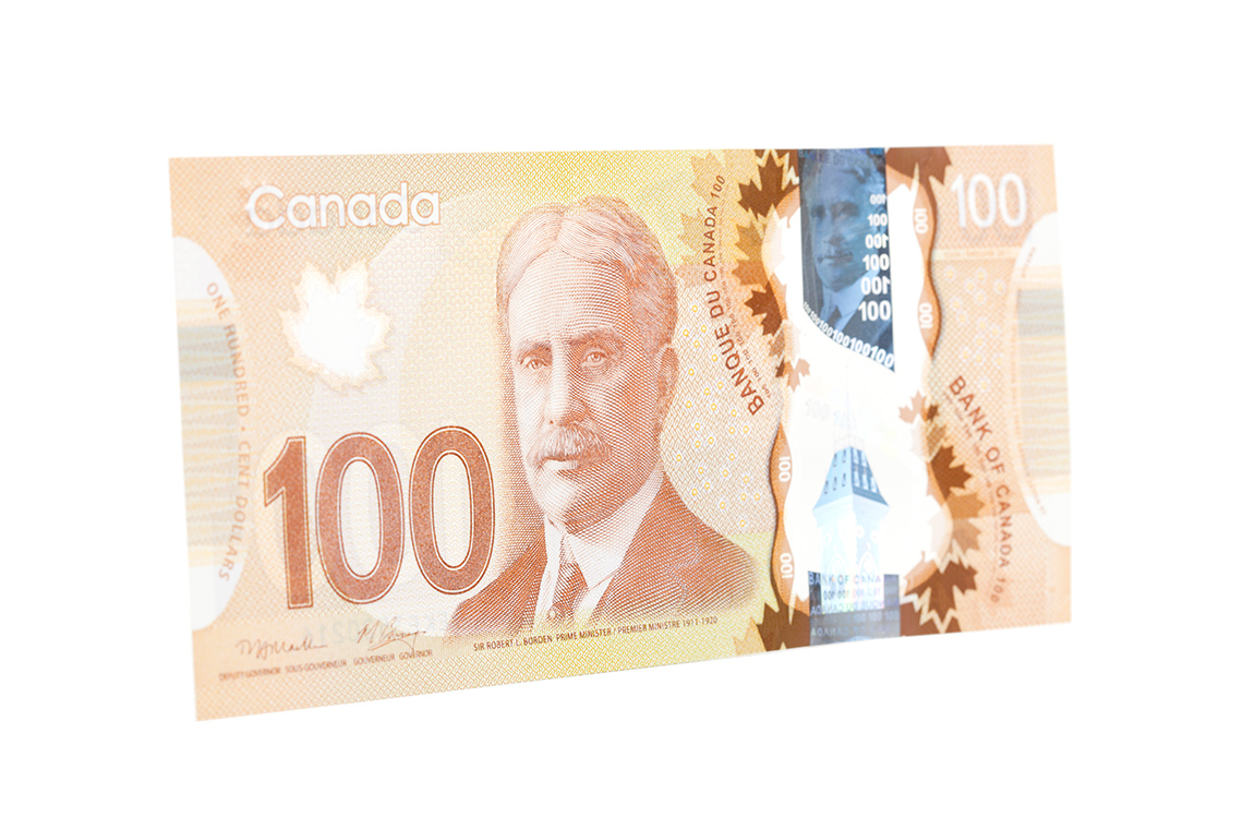A 100-dollar Canadian Bill. The bill has a 100 on the front and a picture of Prime Minister Robert Borden