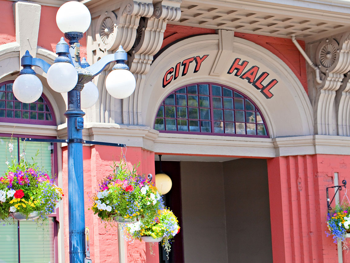 A close up of a city hall building. 
