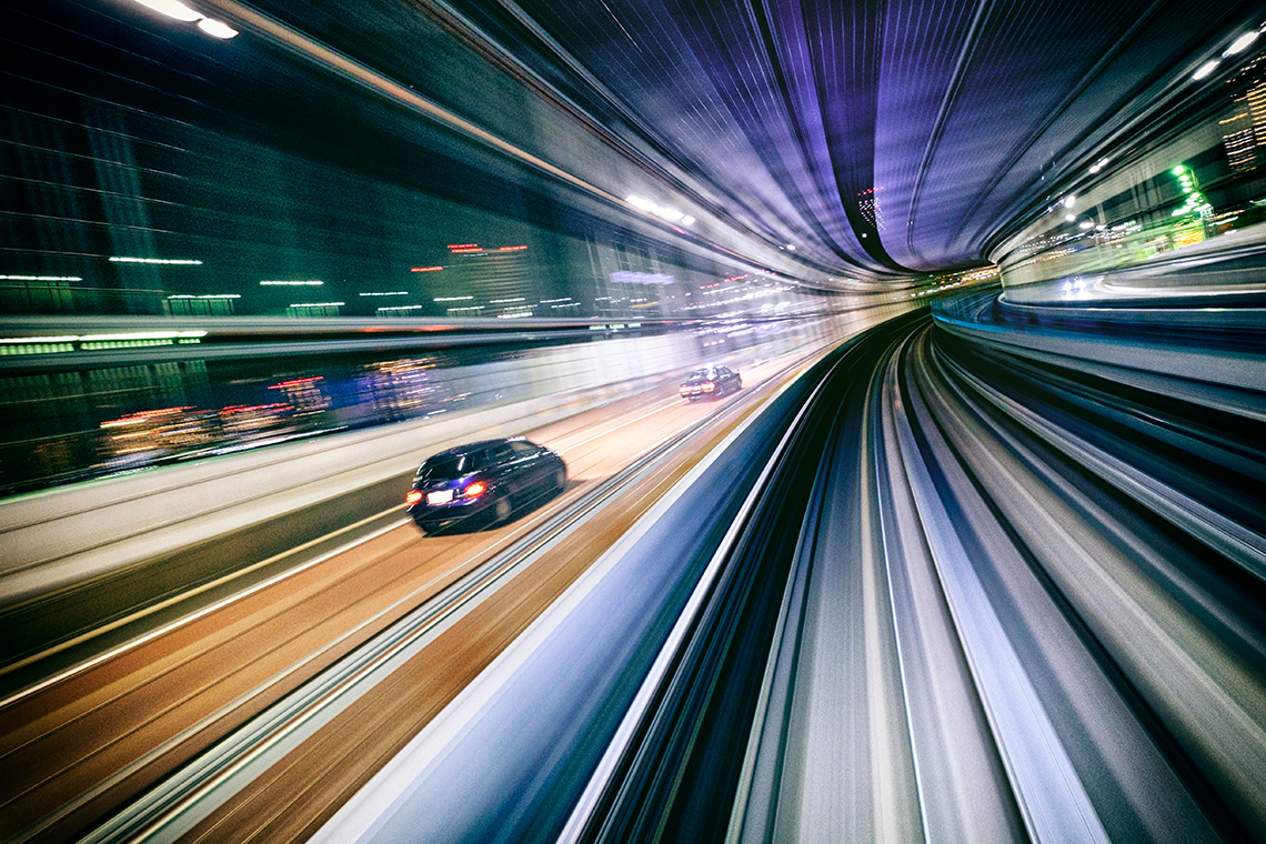 Cars moving quickly through a tunnel