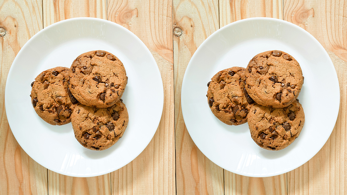 Two plates, each with three cookies in them