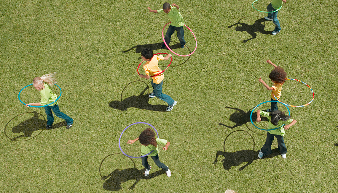 Children playing with round hoops.