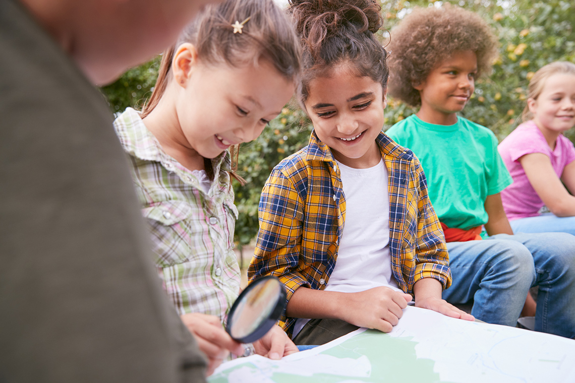 Children exploring a map.