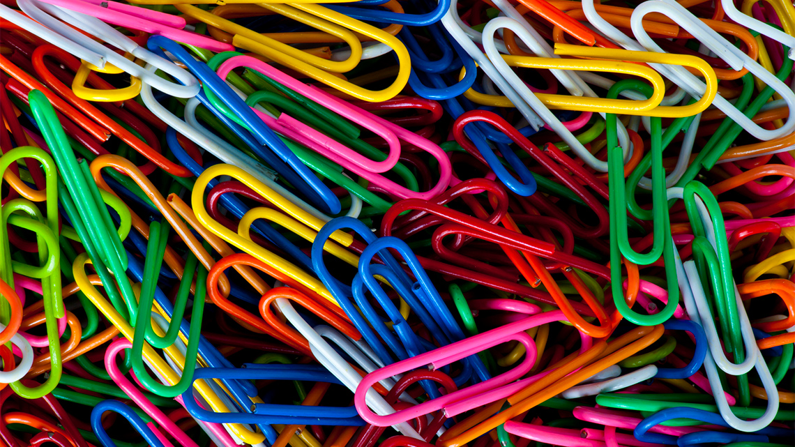 Pile of colourful paper clips.
