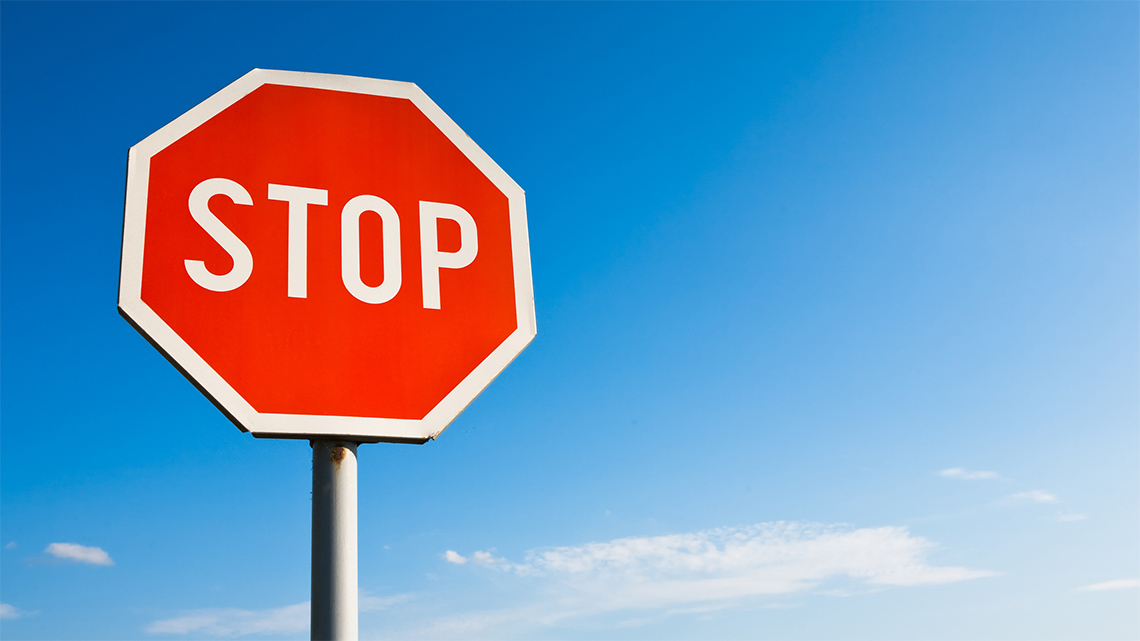 An octagon with the word STOP written in the middle.