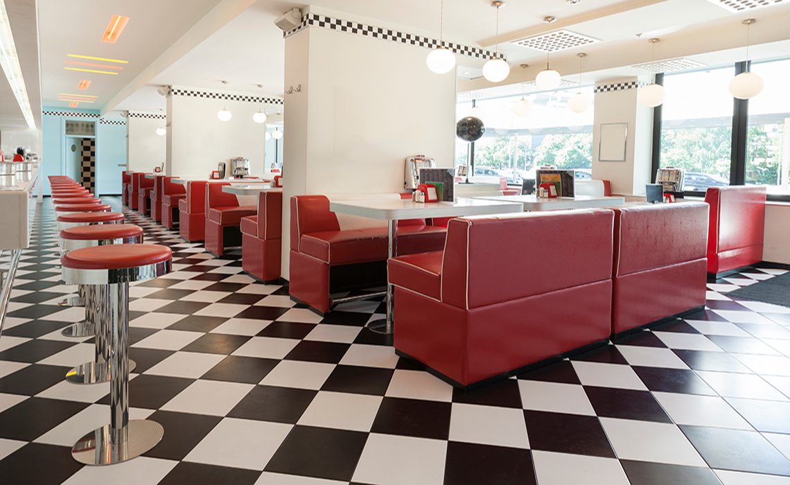 A floor with black and white checkerboard tiles.