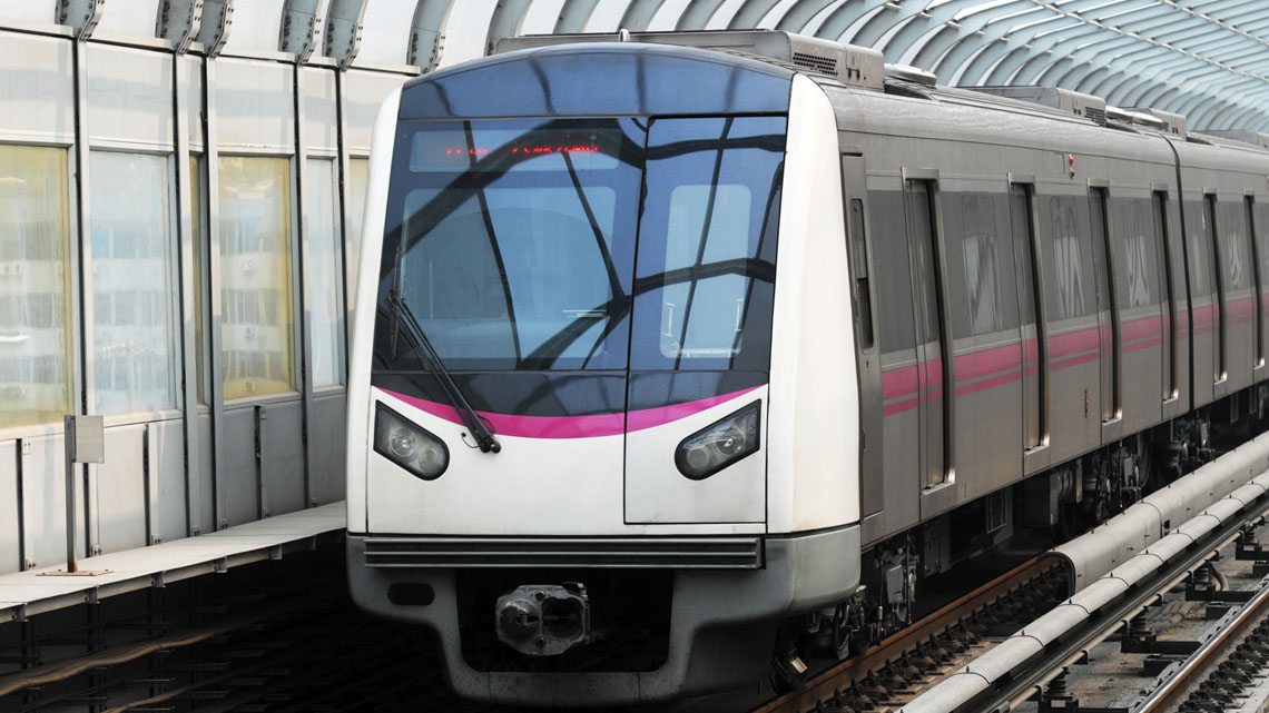 A train pulling up to a station stop.