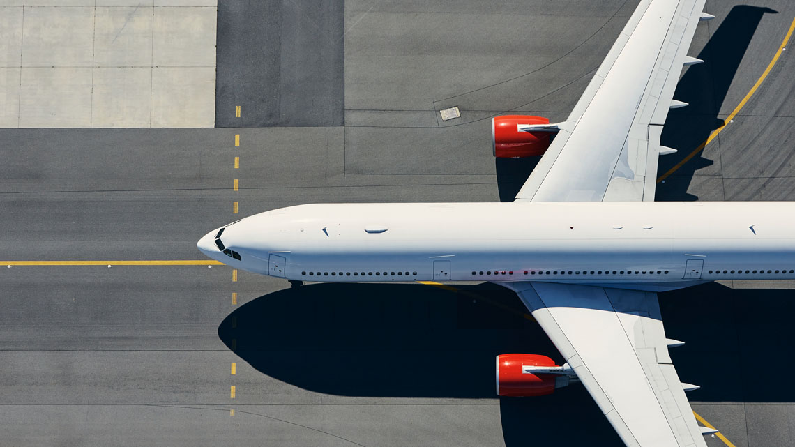 An airplane is parked on the airport tarmac.