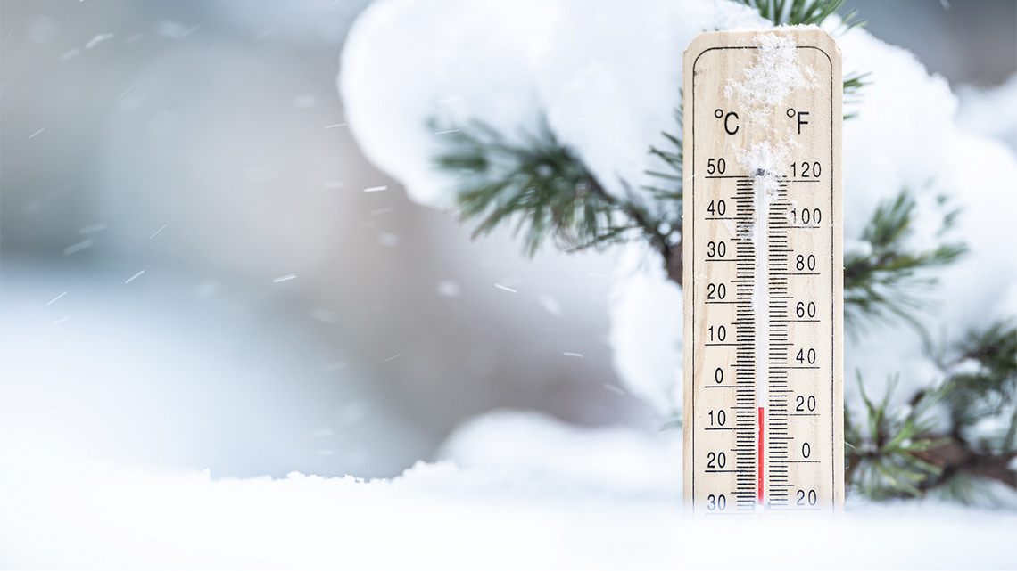 Thermometer A thermometer outside during a snowy day showing -5 degrees Celsius or 23 degrees Fahrenheit.