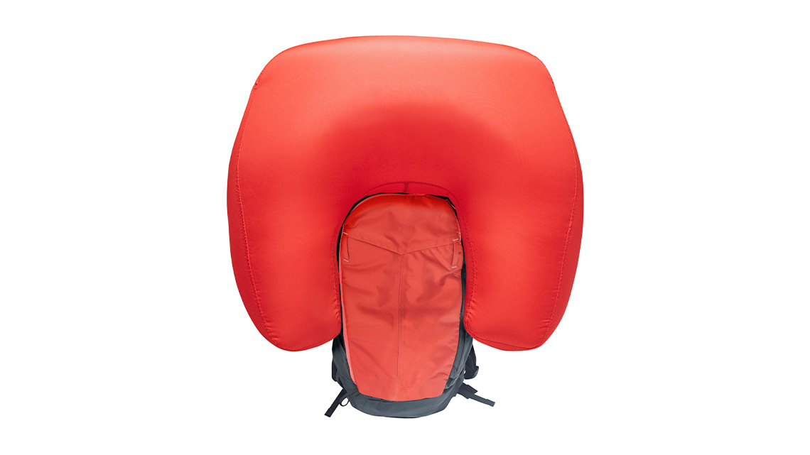 An avalanche airbag activated. The airbag is filled to resemble a large curved balloon.