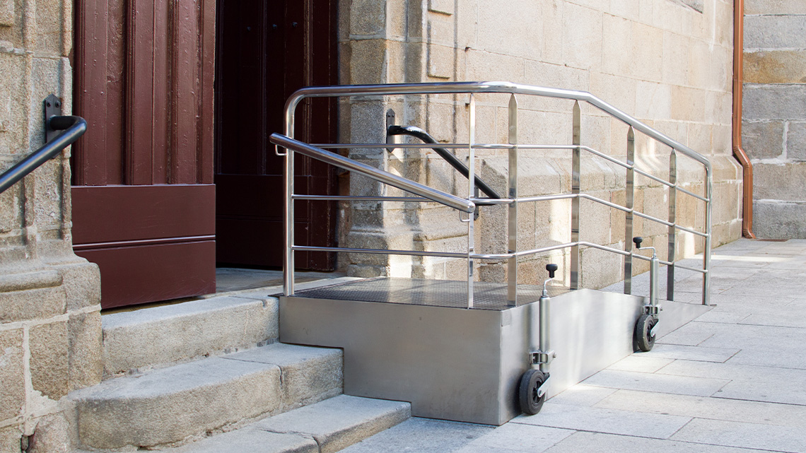 A accessibility ramp at the entrance of a building. 