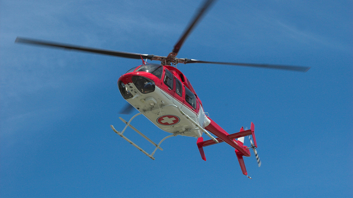 A medical helicopter flying in the sky.