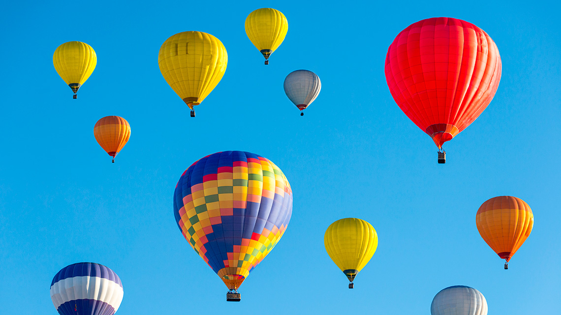 Hot air balloons flying in the sky.