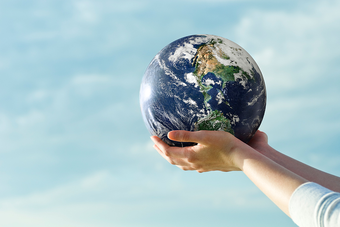 A person holding the world in their hands.