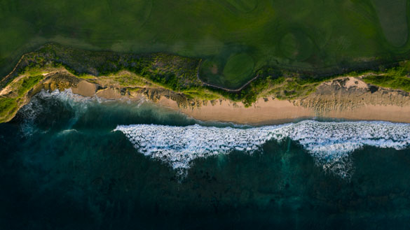 A aerial view of a sandy coastline.