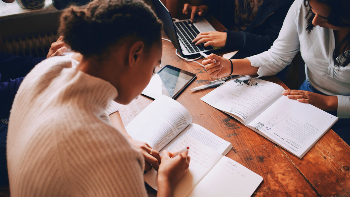 Three students studying together.
