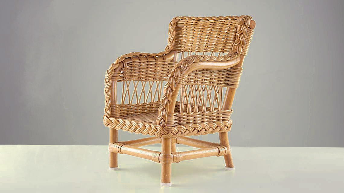 An armchair that has been woven from twigs of a willow tree.