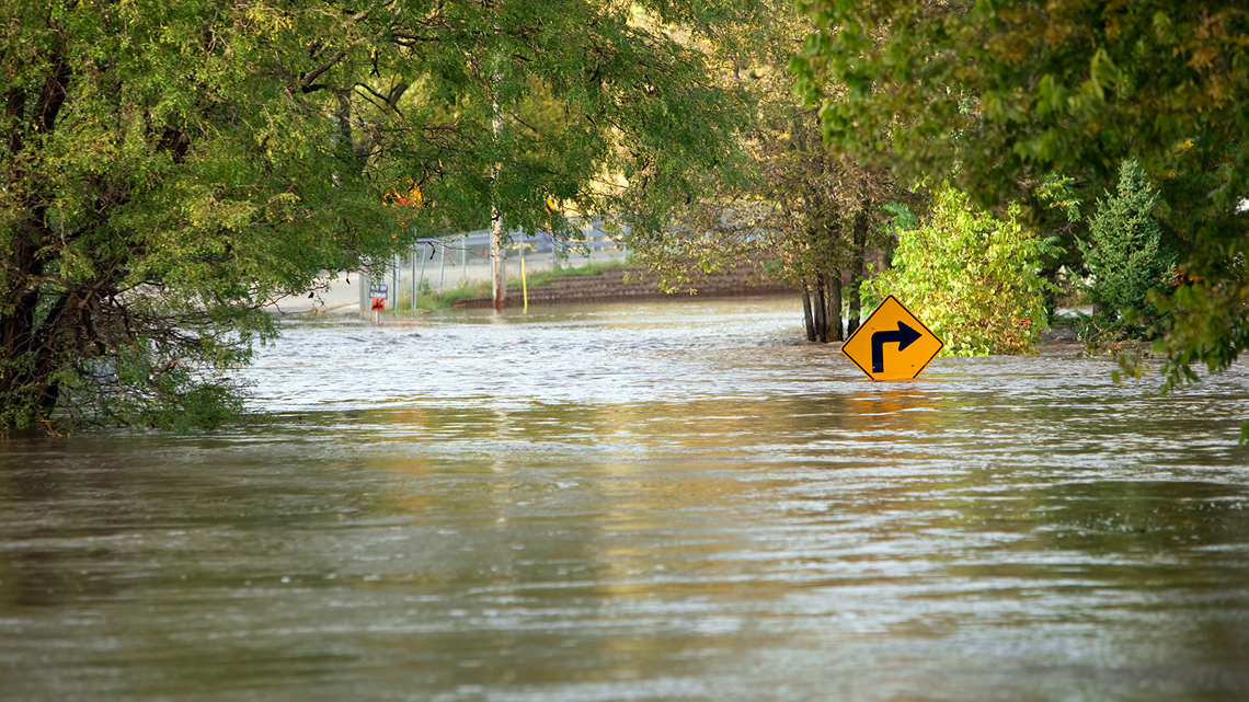 Flooded roadway with water.
