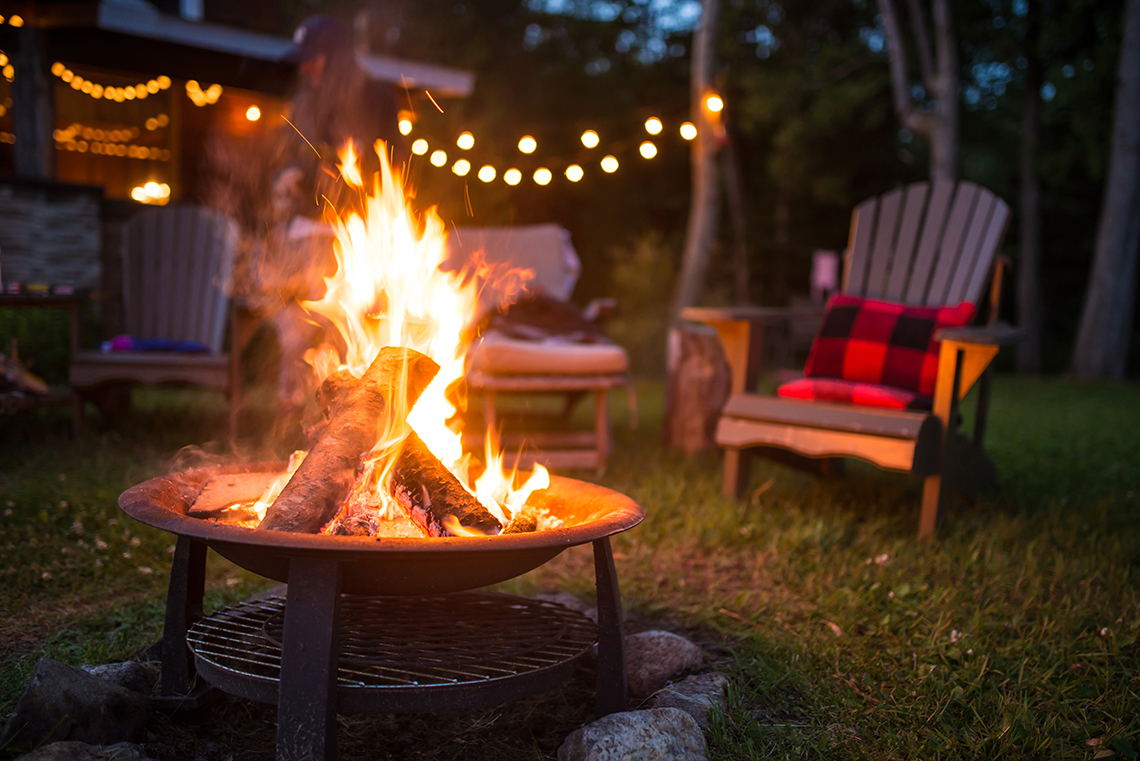 Chairs around a campfire.