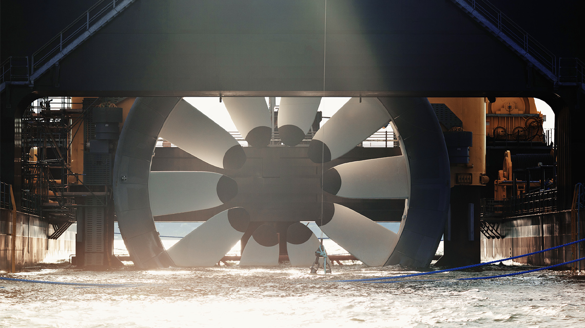 This is a wheel that is partly in the water that turns when the water hits it.