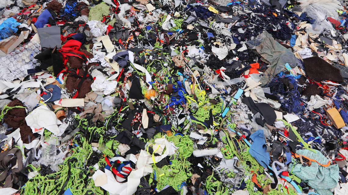 This is just one pile of garbage found in a landfill. There are many pieces of clothing in this pile