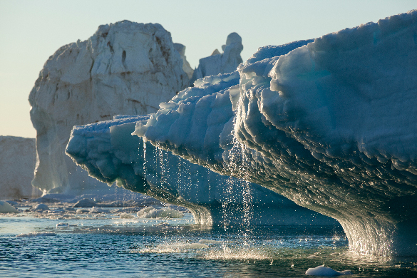 Melting glacier A large glacier melting, dripping into the ocean.