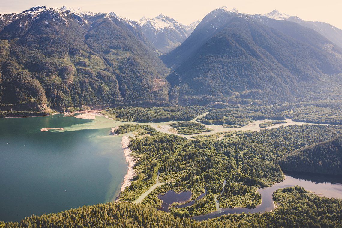 A watershed made up of mountains, lowlands with rivers and lakes, and the ocean.