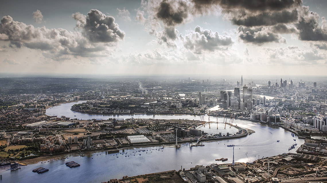 An overhead view of the Thames River winding through the city of London.