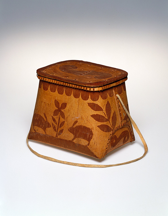 A basket made from fashioned spruce tree and designed with images of plants and animals.