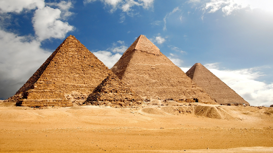Triangle-shaped pyramids in the desert in Egypt.