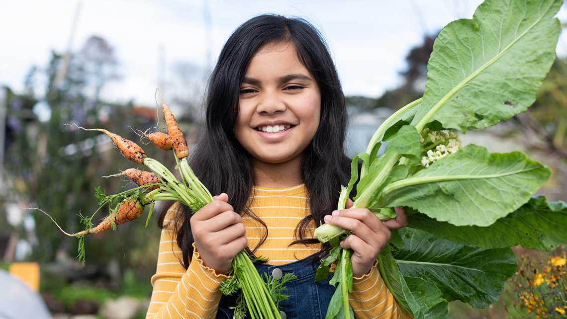 A learner growing vegetables in a vegetable garden.