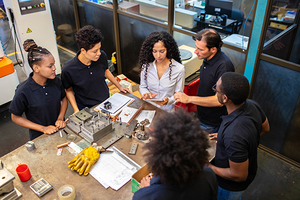 An engineer plans a building project with her team.