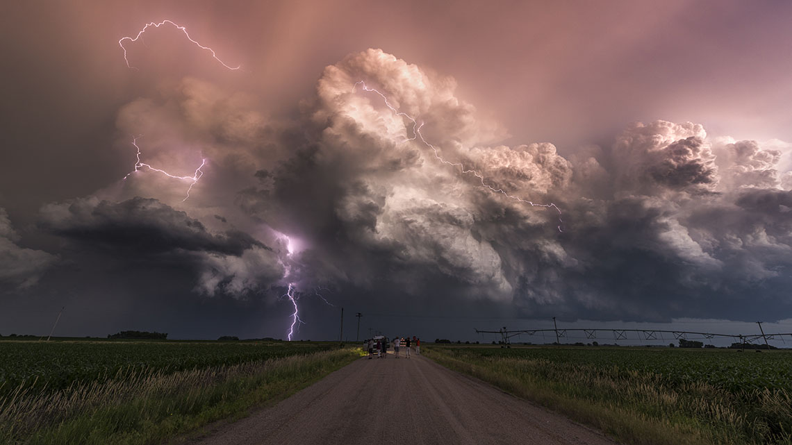 Storm A storm with large clouds and lightning over a field.