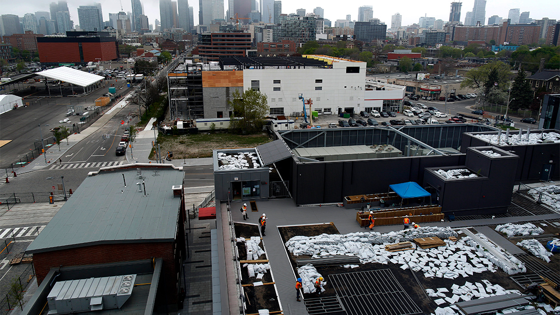 The YMCA Roof is being prepared by construction workers.