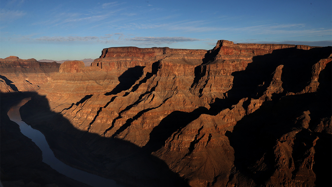A huge canyon with a river running through the middle.