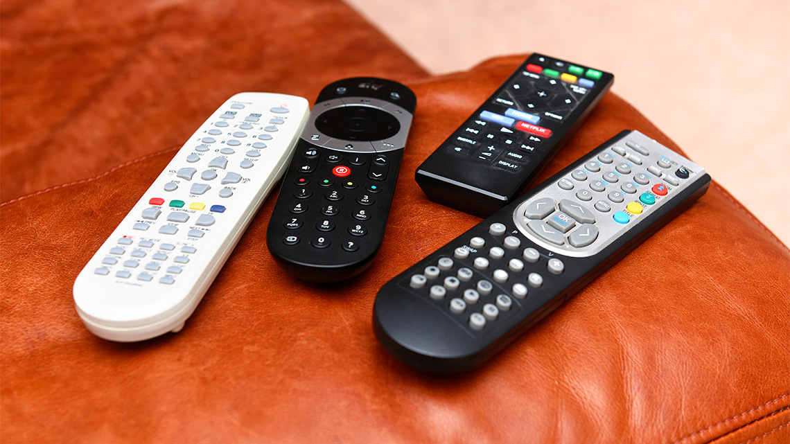 Different sizes and shapes of generic remote controls used for electronic devices.