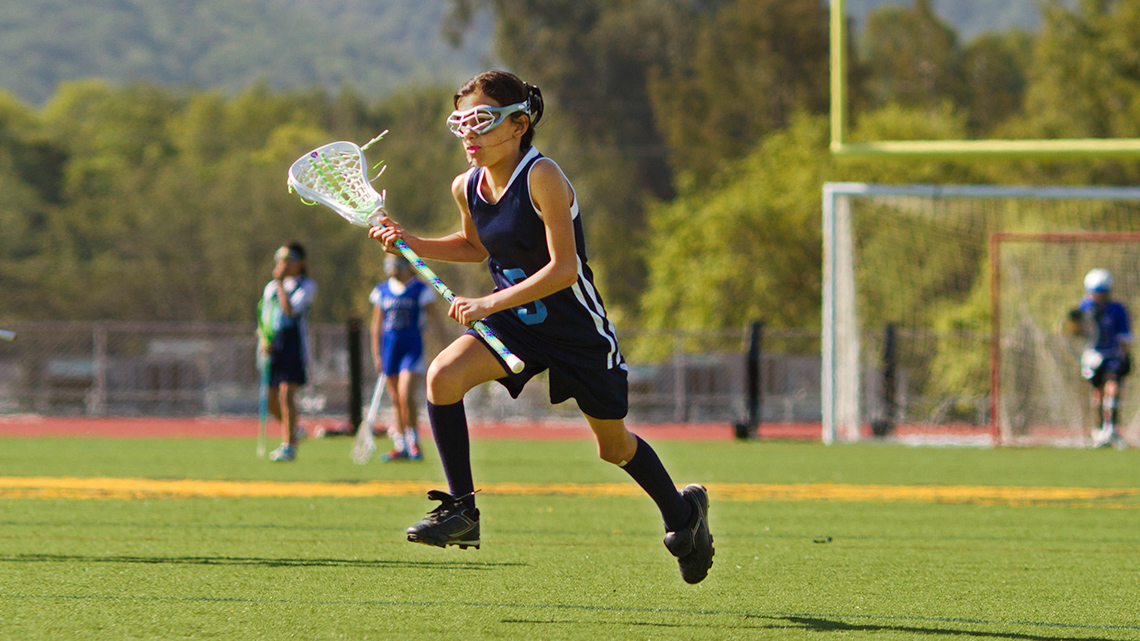A person playing lacrosse