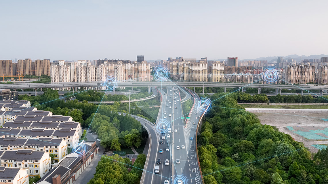 A multi-lane highway. There are blue circles around some vehicles. Lines connect those circles to other circles in surrounding locations.