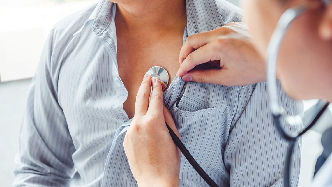 Doctor examining a patient with a stethoscope.