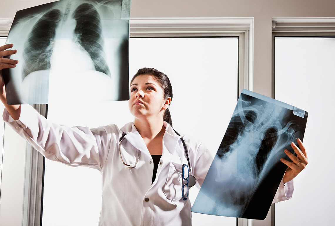 Doctor examining an X-ray