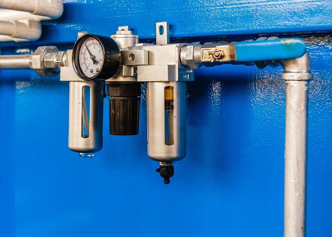 a machine with a gauge that measures flow rate.