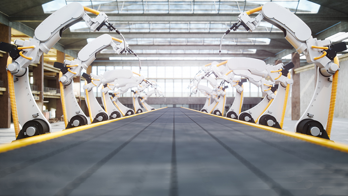 Welding robots and a conveyor belt.