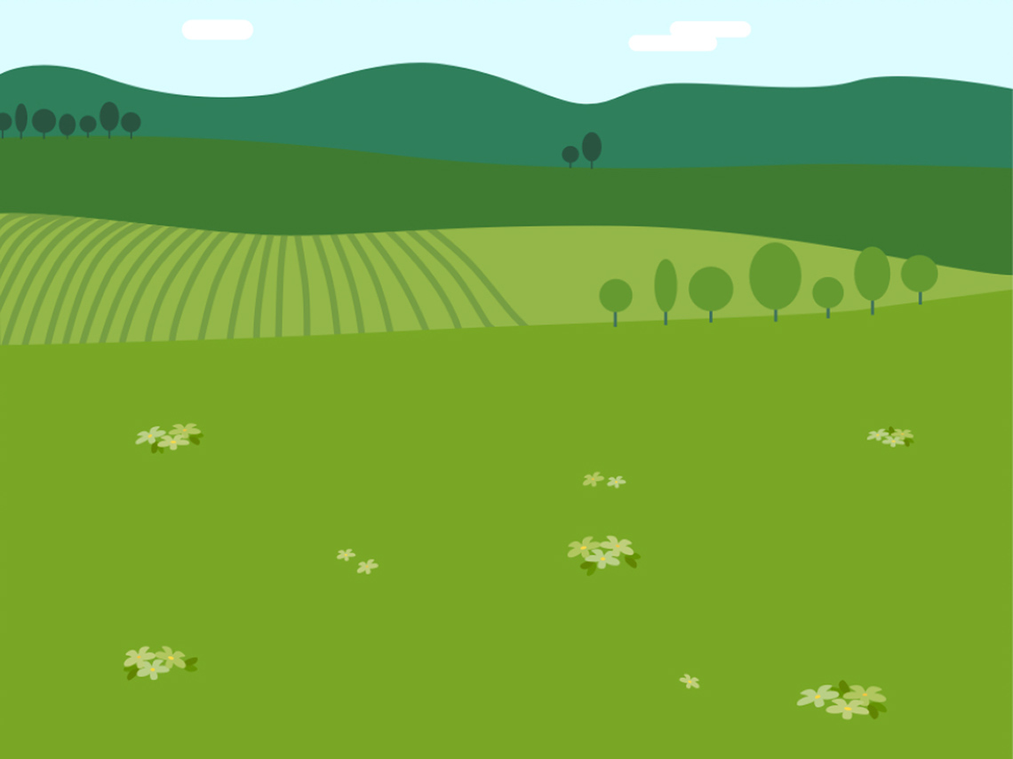 Grassy fields with hills in the background and a blue sky.