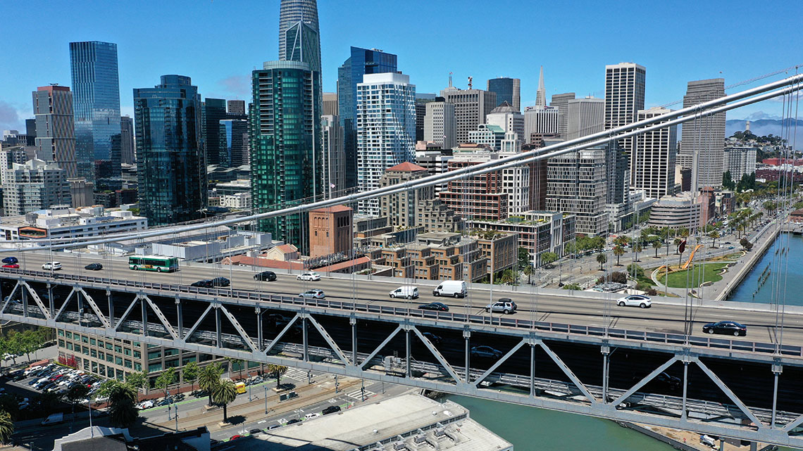 A suspension bridge supporting two levels with the use of several triangles acting as struts and ties.