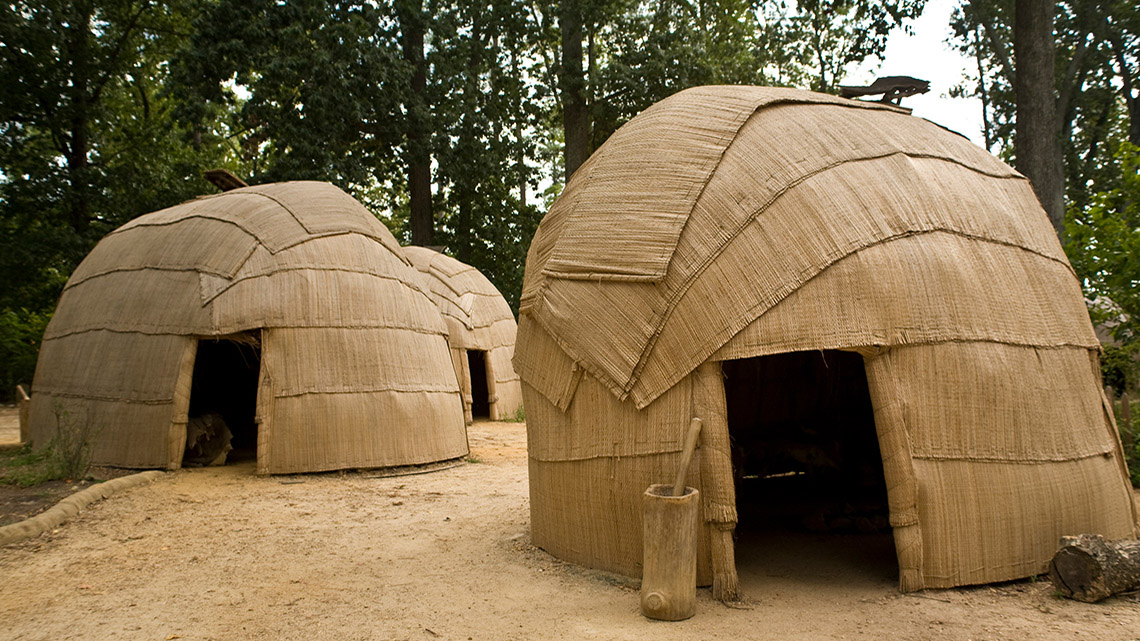 Small dome-shaped structures covered in mats made of reeds.
