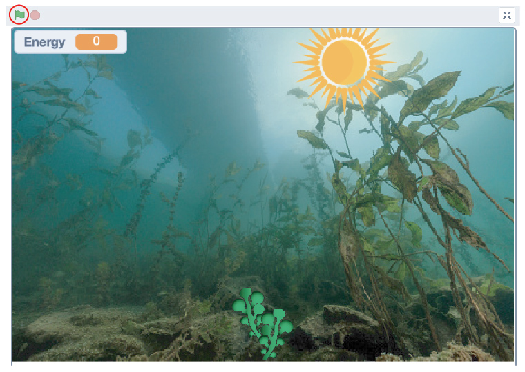 A part of the Scratch interface with the green flag indicated with a circle. It shows an underwater lake with plants and the sun shining.